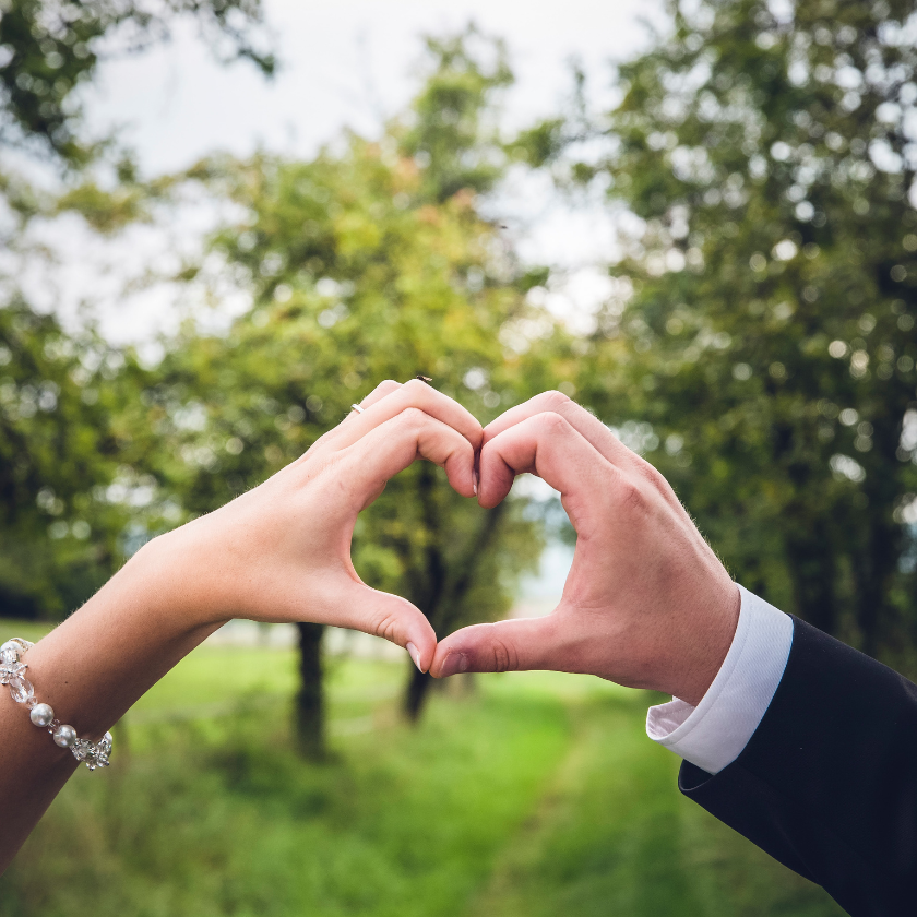 two hands making a heart