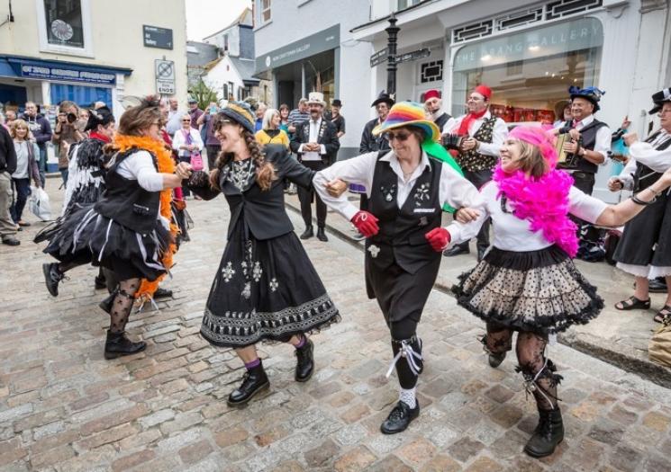 People dancing at St Ives September Festival having fun in Cornish autumn.