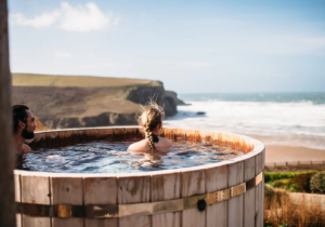 The Scarlet Hotel - couple enjoying hot tub in Cornwall